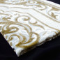 Opalescent velvet rug, gold colour, central "arabesque" motif